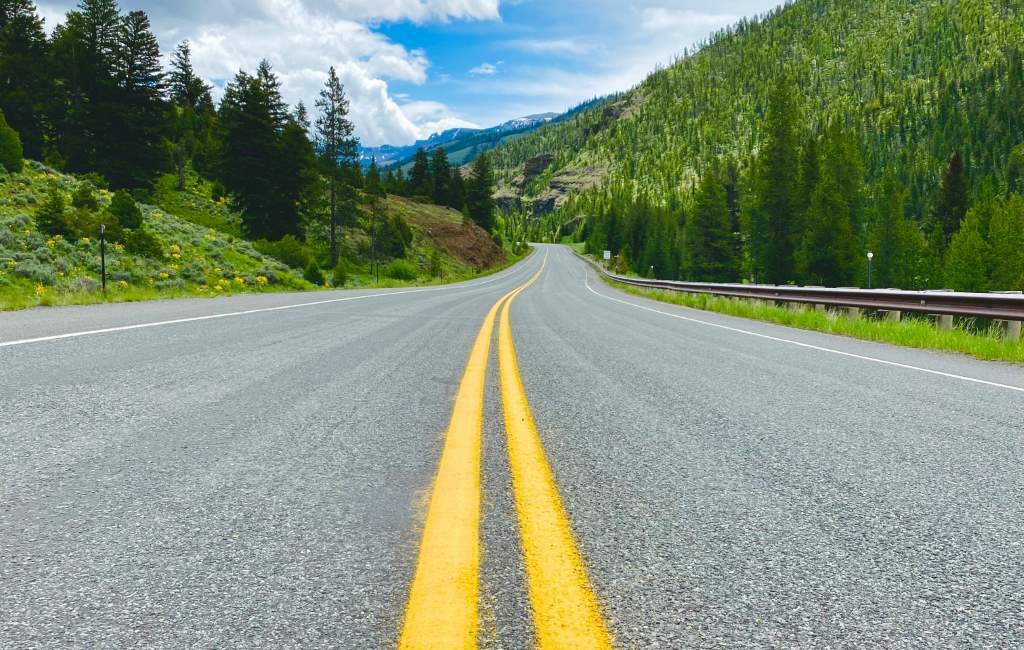 Two-lane mountain highway through BC forest