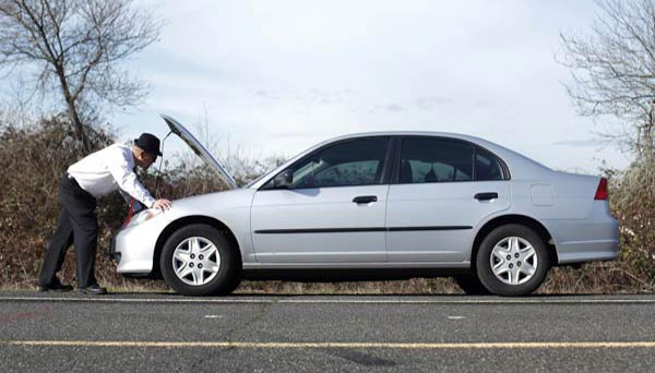 man needing roadside assistance with car broken down